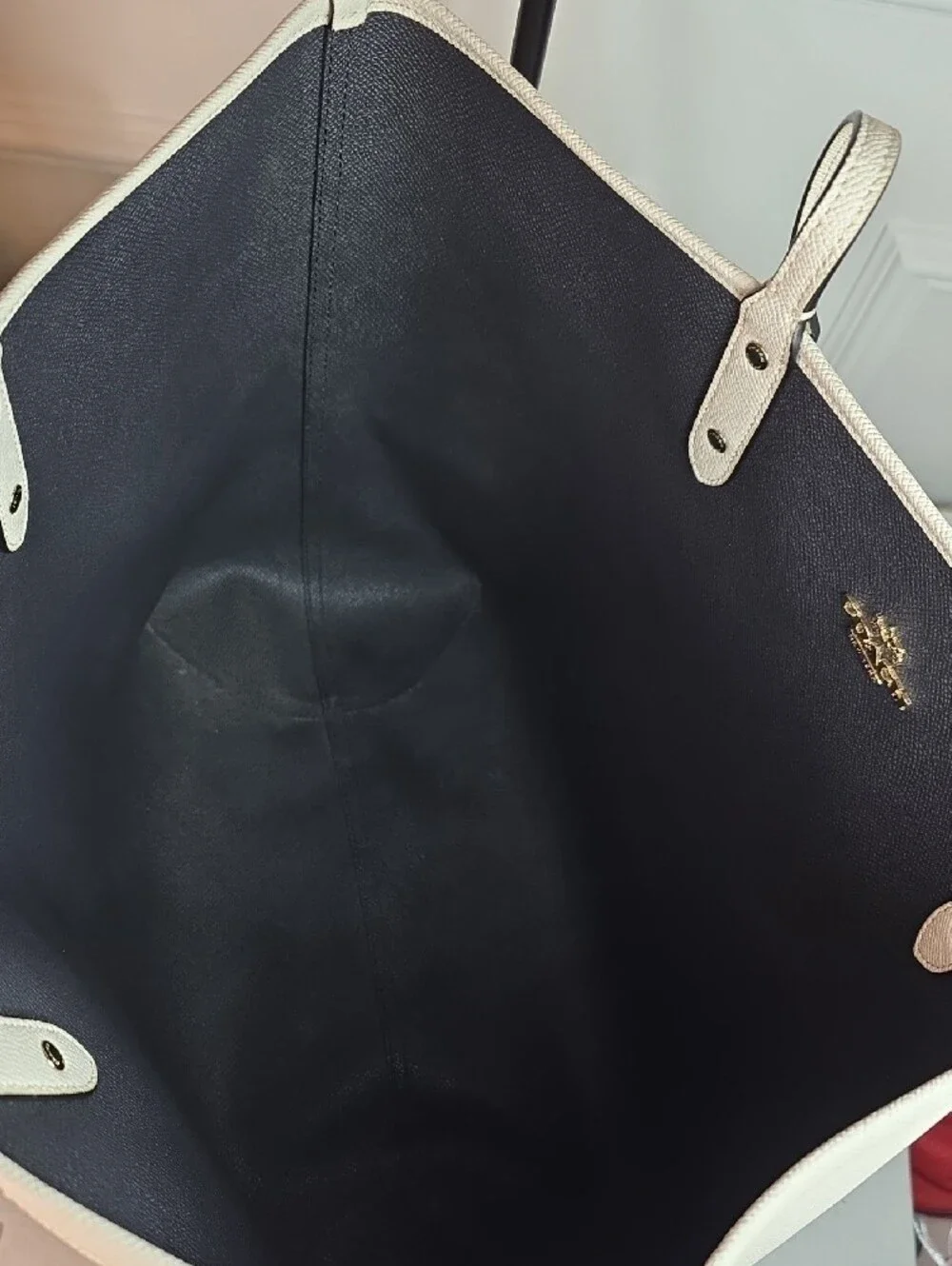 Coach Reversible City Tote crafted in light chalk leather